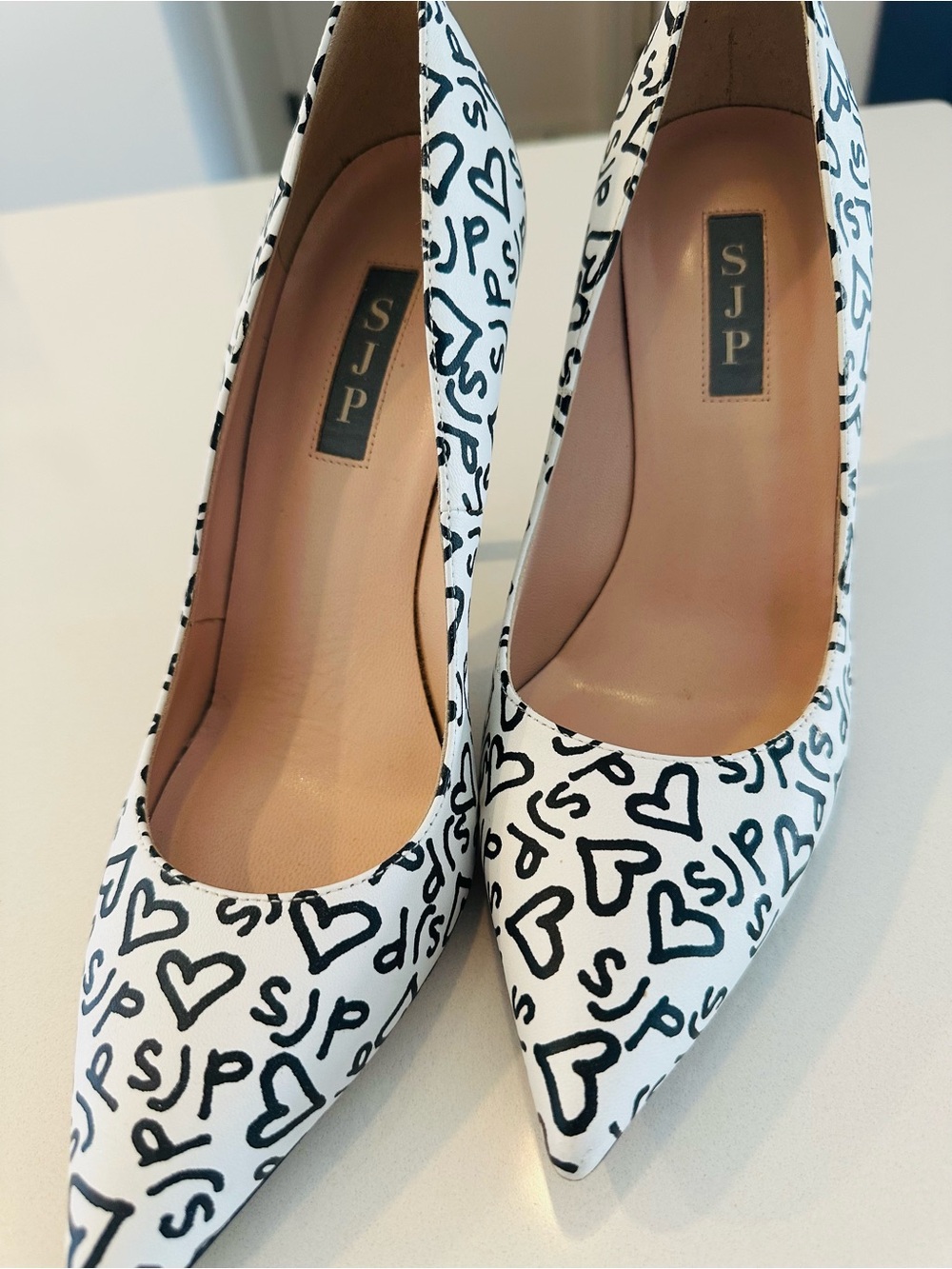 SJP by Sarah Jessica Parker White Pumps with Black Heart & Logo Print